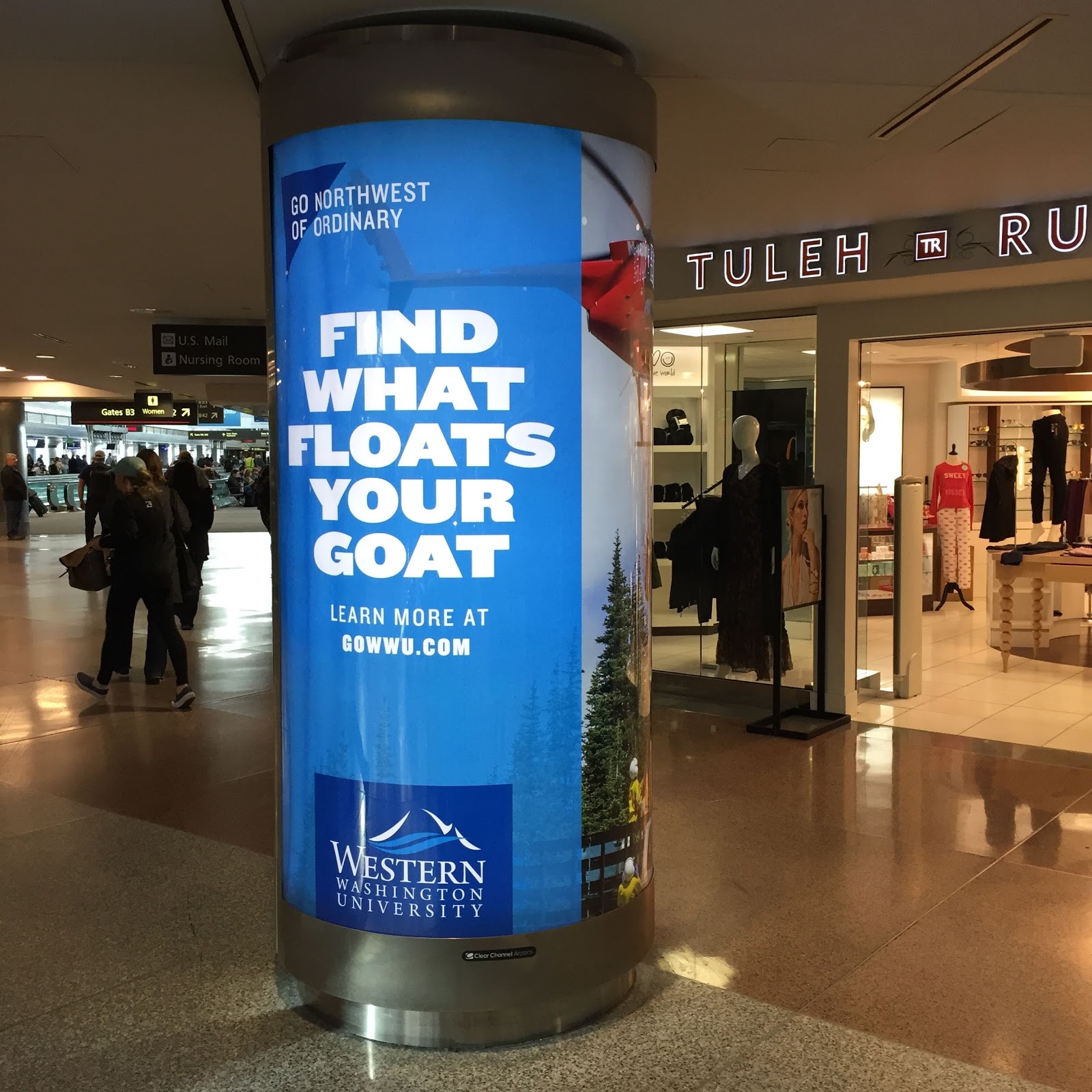 "Find What Floats Your Goat" ad on a pillar in an airport 